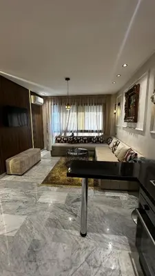 a large living room with a couch and a table at Luxurious Studio in Casablanca in Casablanca