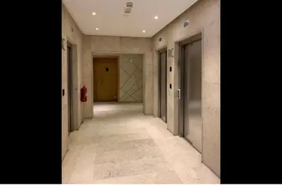 an empty hallway in a building with a fire hydrant at Appartement entier 2 chambres marina avec vue panoramique mer in Casablanca