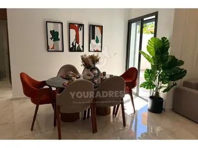 a dining room with a table and chairs at Youradress Casablanca - Maarif in Casablanca