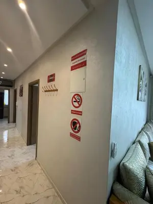 a room with signs on the wall of a building at Appartement Casablanca près de la mer in Dar Bouazza