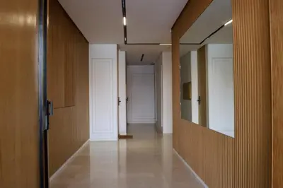 an empty hallway with a door and a mirror at Luxury Oasis Apartment -Rooftop Pool & Home Cinema in Casablanca