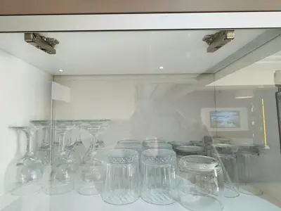 a display case with clear glasses in a window at Urban square - comfortable, sunny, and fully equipped in Casablanca