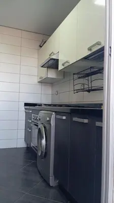 a kitchen with a washing machine in a kitchen at La Siesta Beach Resort in Mohammedia