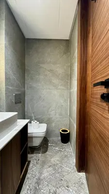 a bathroom with a toilet and a sink at Rooftop Pool Studio - By AppartAli in Casablanca