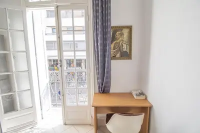 a room with a desk in front of a window at Spacious Family Apartment in Casablanca in Casablanca