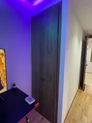a room with a wooden door with a purple ceiling at Luxoria 2 californie in Casablanca
