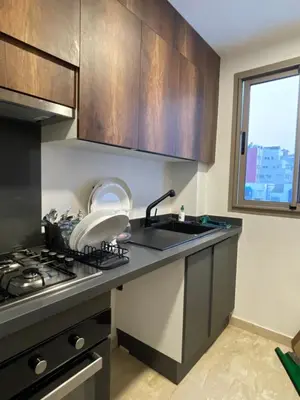 a kitchen with a sink and a stove at Luxoria 2 californie in Casablanca