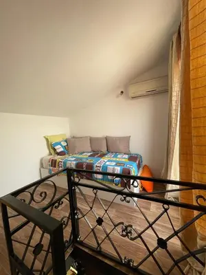 a room with a bed in a room with at Apartment in a beachfront complex in Casablanca