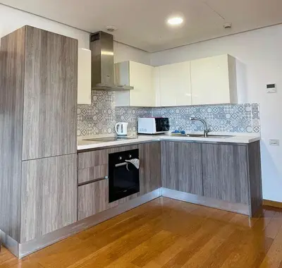 a kitchen with a sink and a counter top at Élégance et Vue sur l'Océan in Casablanca