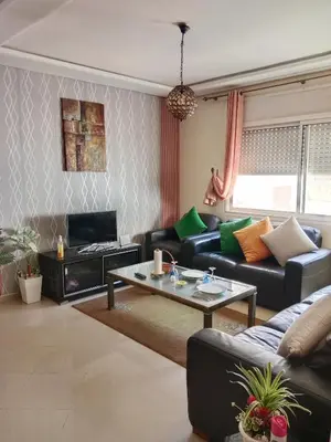 a living room with couches and a coffee table at La maison de rêve in Casablanca
