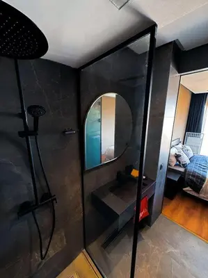 a bathroom with a mirror and a sink and a bed at Carpediem in Casablanca