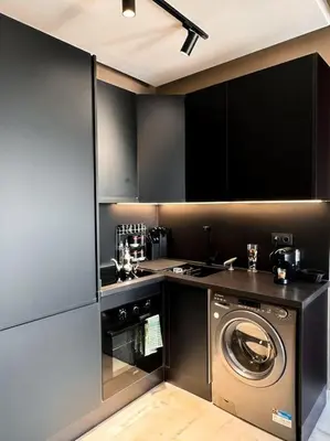 a kitchen with a washer and a washing machine at Carpediem in Casablanca