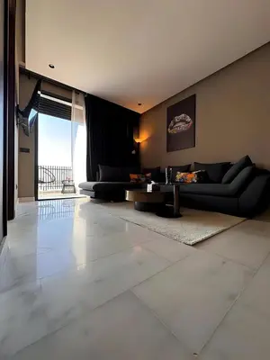 a living room with two couches and a table at Carpediem in Casablanca
