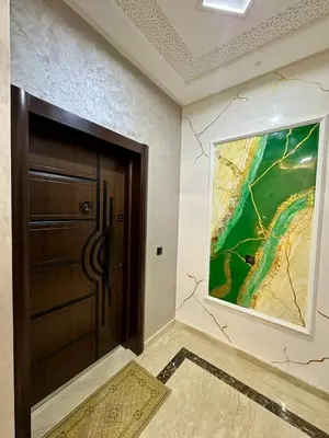 a door in a room with a painting on the wall at Appartement haut standing, 2 chambres - Mohammedia in Mohammedia