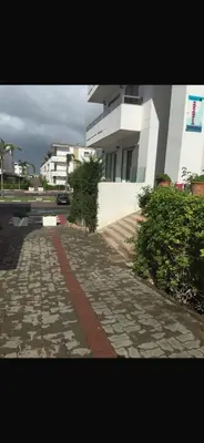 a cobblestone street in front of a building at Marbella Beach apartement holiday 2 chambres,piscine et plage in Mansouria
