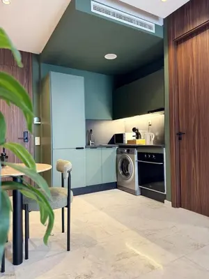 a kitchen with a washer and a washing machine at Luxury Studio Oasis in Casablanca