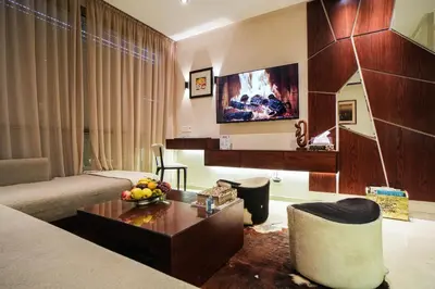 a living room with a couch and a table at Domaine d'Anfa - Luxe & Mer in Casablanca