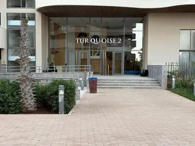 a front view of a building with a tumulusose sign on it at شقة فاخرة - Luxury apartment in Casablanca