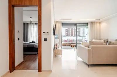 a living room with a couch and a bedroom at C04 Comfort & Design Studio with Private Terrace CFC in Casablanca