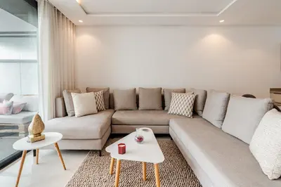 a living room with a couch and a table at C04 Comfort & Design Studio with Private Terrace CFC in Casablanca
