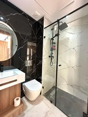 a bathroom with a shower and a toilet and a sink at NESK STAY Maarif - ARENA 41 in Casablanca