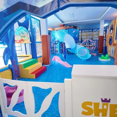 a childrens play room with a slide and slidesktop at Appartement Sidi Rahal Casablanca - proche du SHEMPARK payant, Sidi rahal et tamaris plage in Sidi Rahal