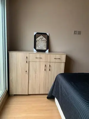 a bedroom with a bed and a box on a dresser at Chic & secure in Casablanca