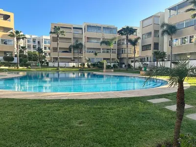 a large swimming pool in front of a building at Vivez Une Expérience Unique à ARMADA in Bouznika