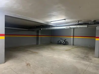 a parking garage with a bike parked in it at Vivez Une Expérience Unique à ARMADA in Bouznika