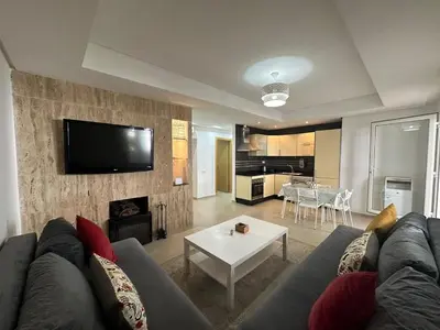 a living room with a couch and a table at Vivez Une Expérience Unique à ARMADA in Bouznika