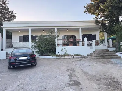 a car parked in front of a house at private villa with swimming pool in Rabat