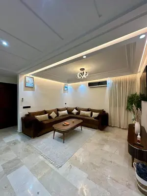 a living room with a couch and a table at Appartement chic - Princesses in Casablanca