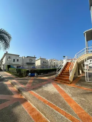 a set of stairs in front of some houses at 2-bedroom duplex for rent in Temara