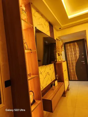 a room with a large mirror and a television at Appartement ainsbaa in Casablanca