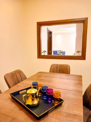 a tray with a tea pot and cups on a table at Elegant Lateral Beachfront Family Stay in Casablanca