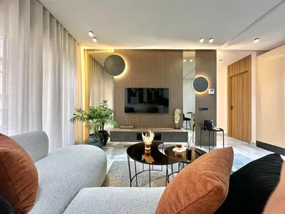 a living room with a couch and a table at Cosy Central Studio with balcony Maarif - Near Twin Center in Casablanca