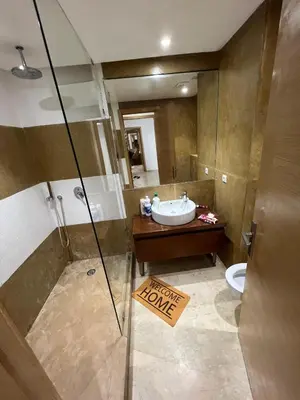 a bathroom with a shower and a sink and a toilet at Tamaris Green in Casablanca
