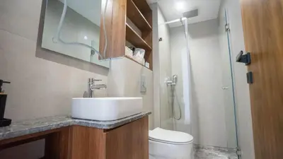 a bathroom with a sink and a toilet and a shower at Cosy stylé et confortable in Casablanca