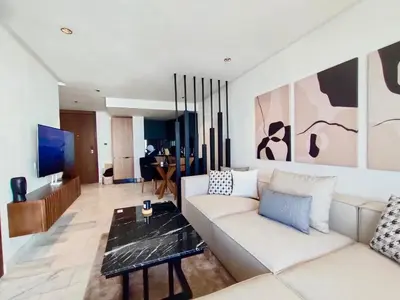 a living room with a white couch and a tv at Beautiful Apartment, Great Location, Fiber Optic in Casablanca