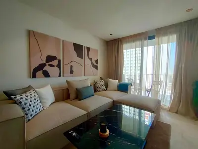 a living room with a couch and a glass coffee table at Beautiful Apartment, Great Location, Fiber Optic in Casablanca