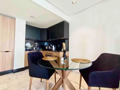 a dining room with a glass table and two chairs at Beautiful Apartment, Great Location, Fiber Optic in Casablanca
