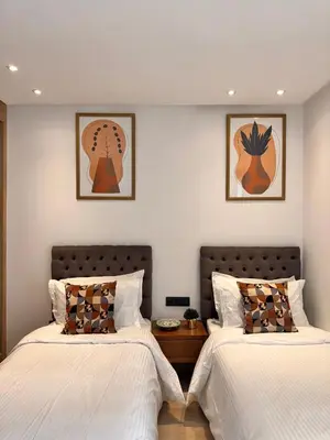 two beds sitting next to each other in a bedroom at Central 2 bedrooms in Casablanca in Casablanca