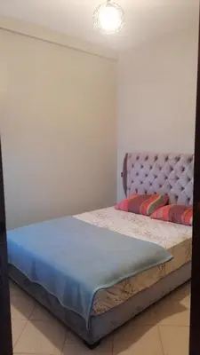 a bedroom with two beds in a room at 50m RDC aliace darna louizia in Mohammedia