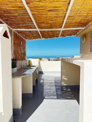 a view of the beach from the patio of a building at Modern House private Pool, Rooftop & beach view in Mohammedia