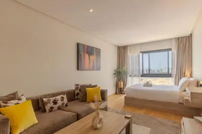a living room with a couch and a bed at Panorama sur l'infini in Casablanca