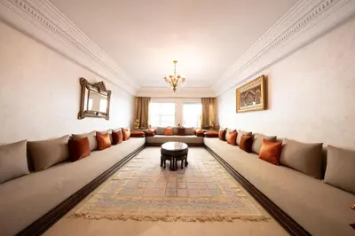 a large living room with couches and a table at Large & Comfy 3 bedrooms in Casablanca Center in Casablanca