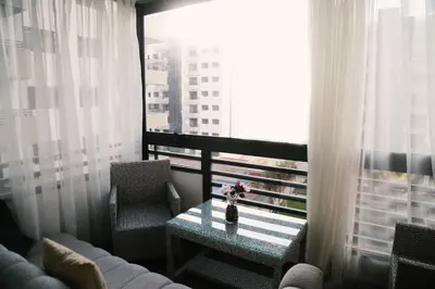 a room with a couch and a table and a window at Studio haut standing CASA in Aïn Harrouda