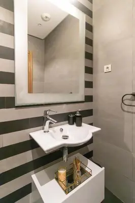 a bathroom with a sink and a mirror at Marina Lifestyle ! in Casablanca