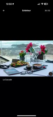 a picture of a table with food and flowers at Studio Cosy au Centre de Casablanca, Idéal pour Découvrir la Ville in Casablanca-Port