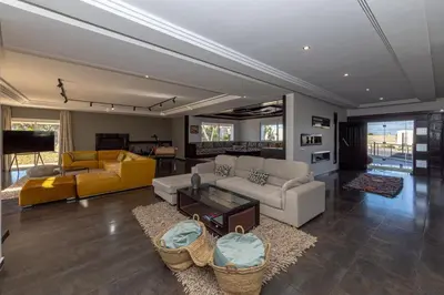 a living room with a couch and a table at Asmae House in Skhirat